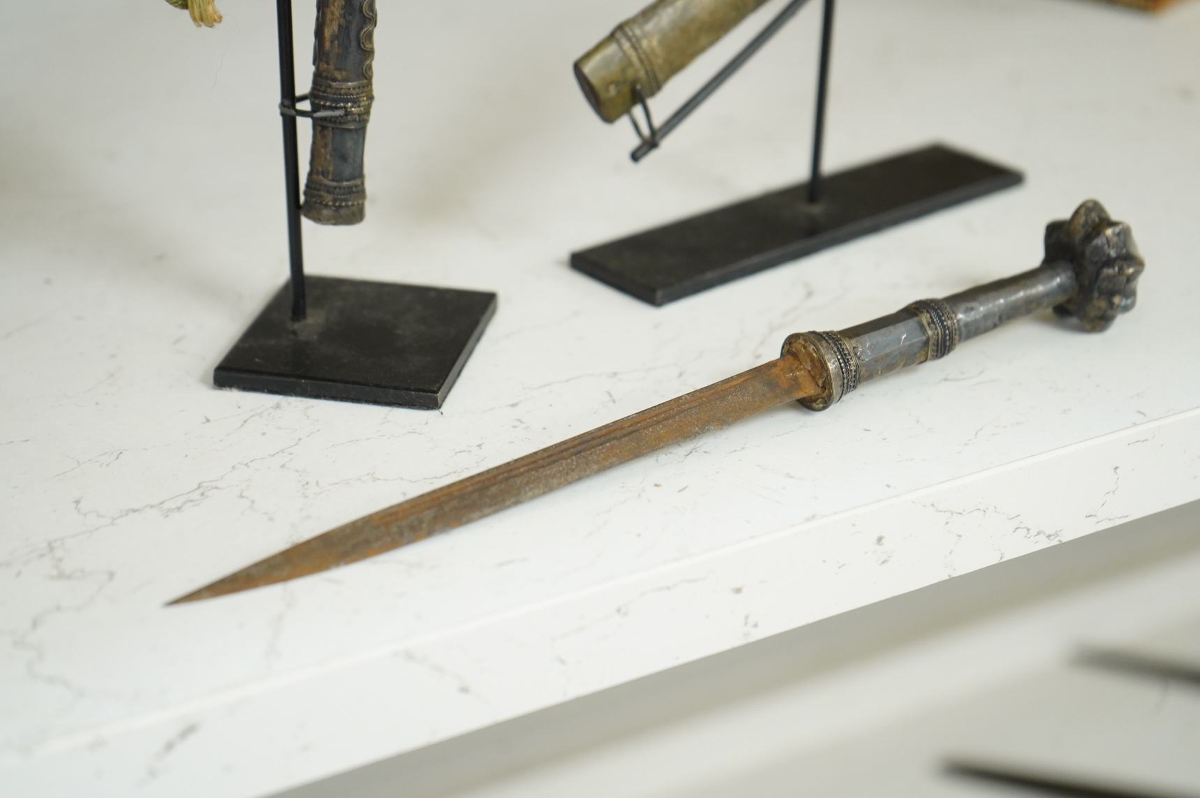 A Burmese dagger dha, blade 14.5cm, hilt and sheath covered in sheet silver filigree decoration, together with an unusual pair of small Burmese knives with silver mounted stag horn handles and silver covered sheath, both